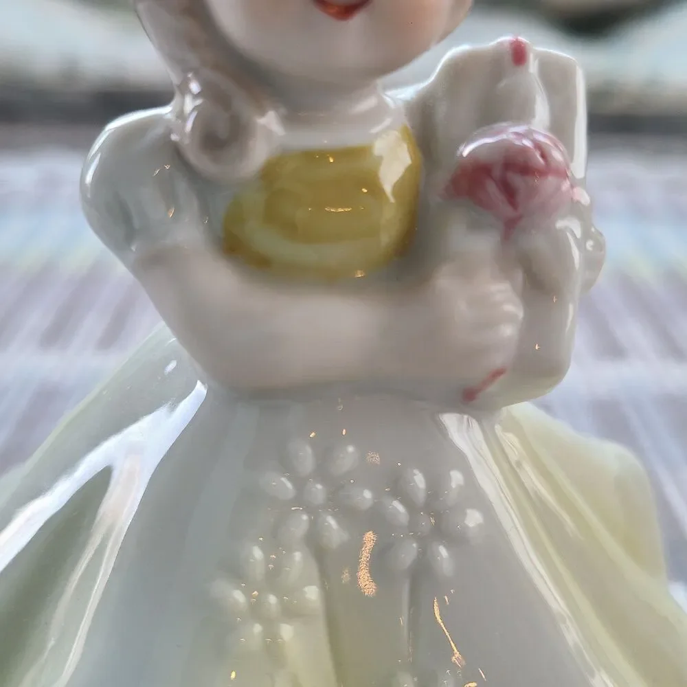 RARE Music Box Figurine With Lovely Young Girl Holding A Gift Plays Look Of Love